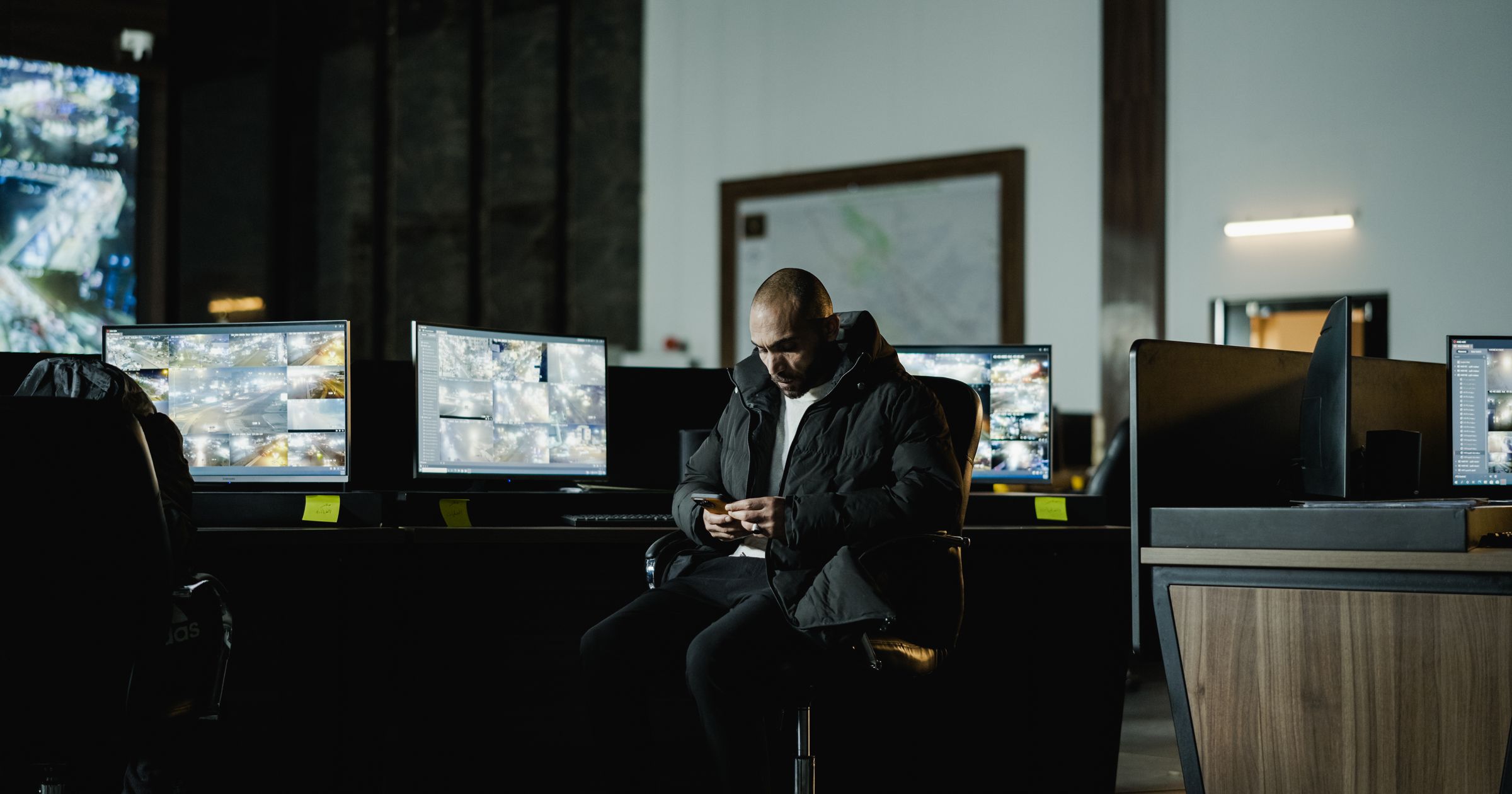 A creative agency professional reviewing an invoice on a computer, with a section that itemises AI model costs alongside project tasks.